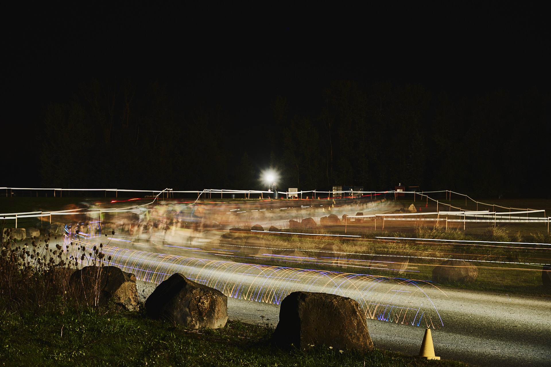 A Blur of Lights and Legs trails off into the distance in this long exposure photograph of the beginning of the Men's 1/2/Pro and Singlespeed Races as the PDX Trophy Cup 2023